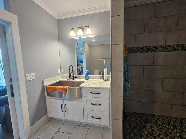 a view of a hallway with wooden floor and furniture