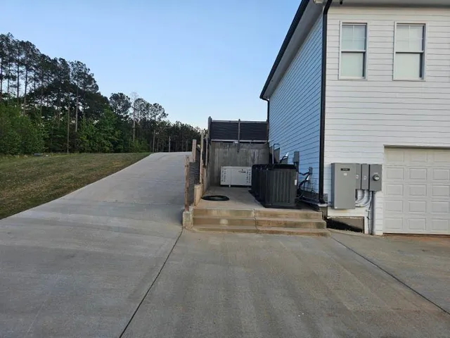 a view of a swimming pool with couches in a patio