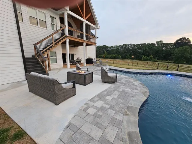 a bed sitting in a kitchen next to a cabinet