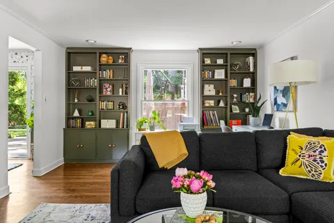 a living room with furniture and a window