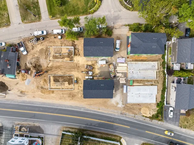 an aerial view of residential houses with outdoor space