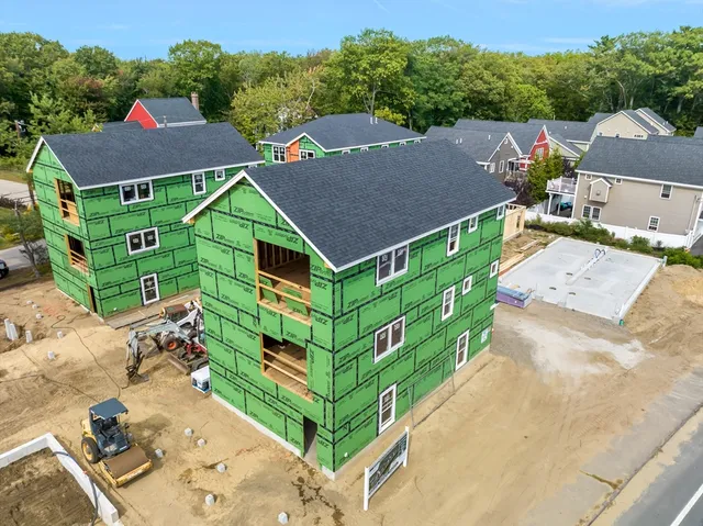 an aerial view of a house with a garden