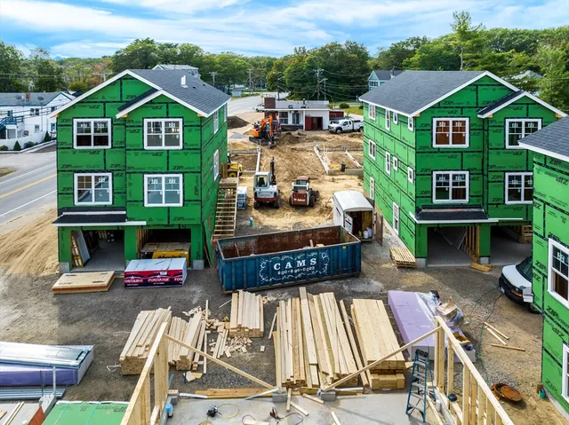 an aerial view of a house with a yard balcony