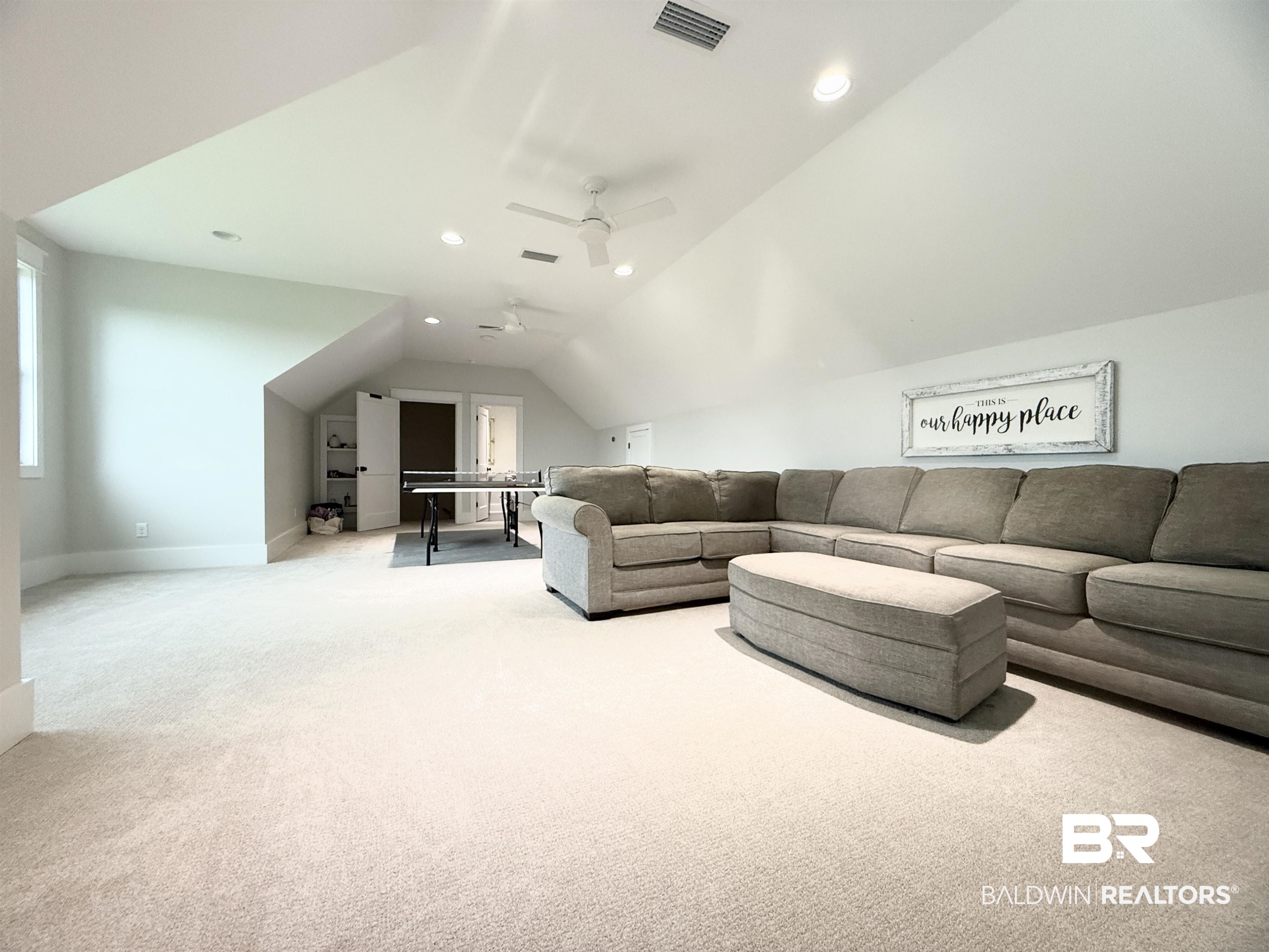 21767 Gallery Boulevard Fairhope, AL 36532 - Photo 50 of 74 Carpeted living area featuring vaulted ceiling, a ceiling fan, and recessed lighting