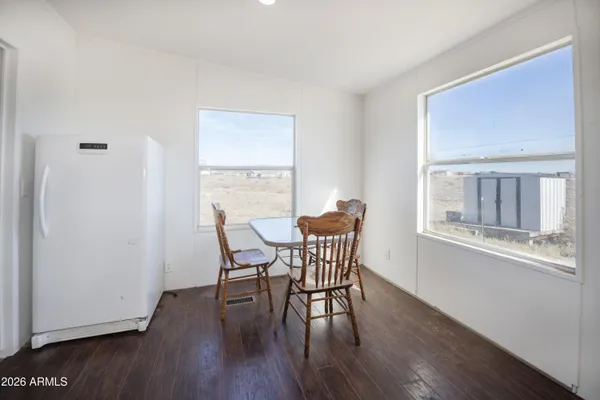 a living room with a bed furniture and a window