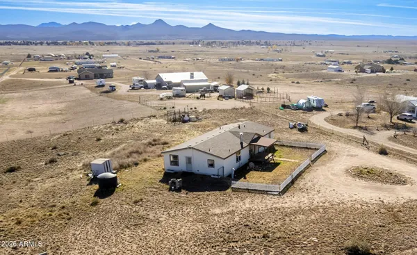 an aerial view of a house with a ocean view