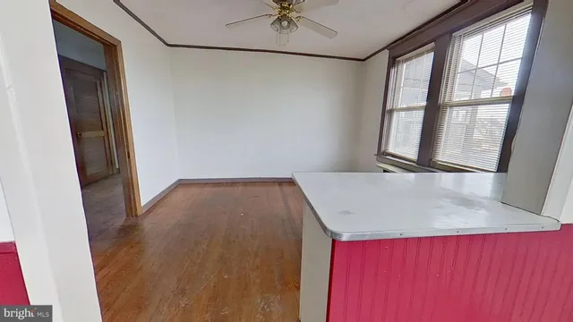 a view of a hallway with a window