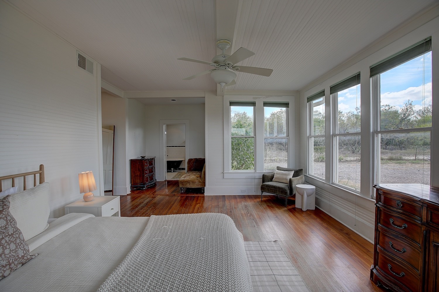11228 Parsons Road Manor, TX 78653 - Photo 20 of 40 a living room with furniture and large windows