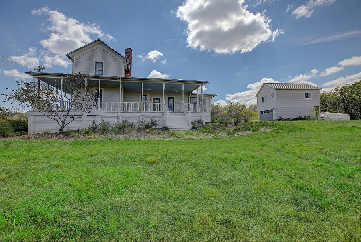 11228 Parsons Road Manor, TX 78653 - Photo 2 of 40 a front view of a house with a yard and garage