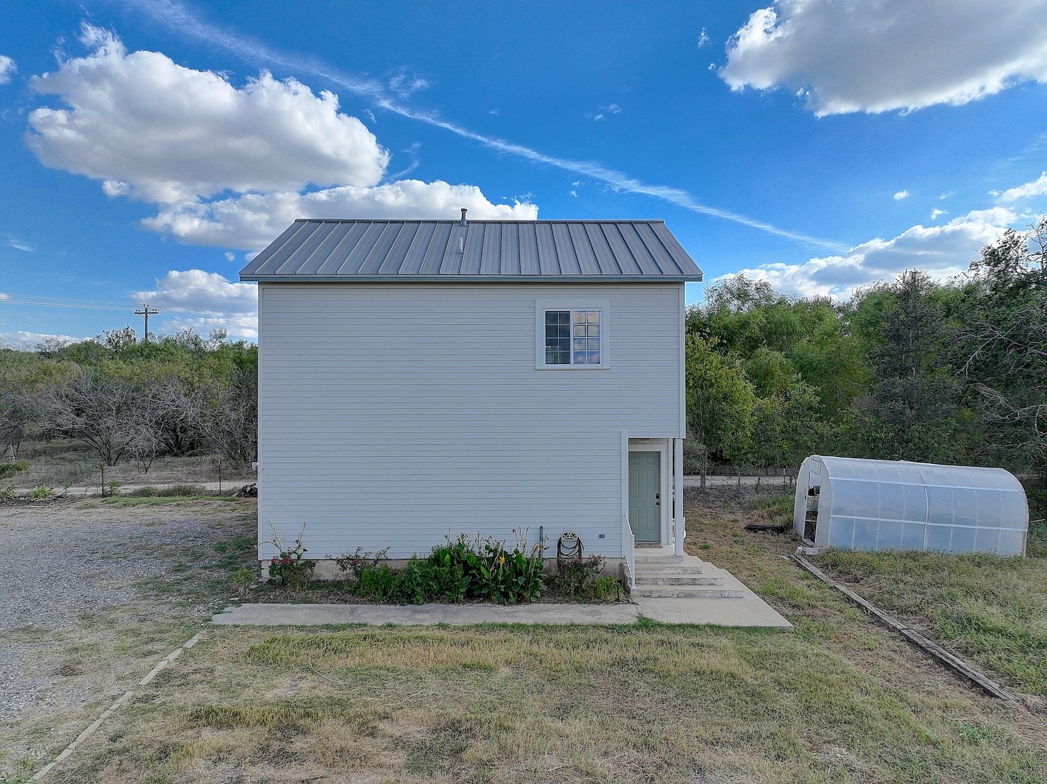 11228 Parsons Road Manor, TX 78653 - Photo 31 of 40 a front view of a house with a yard