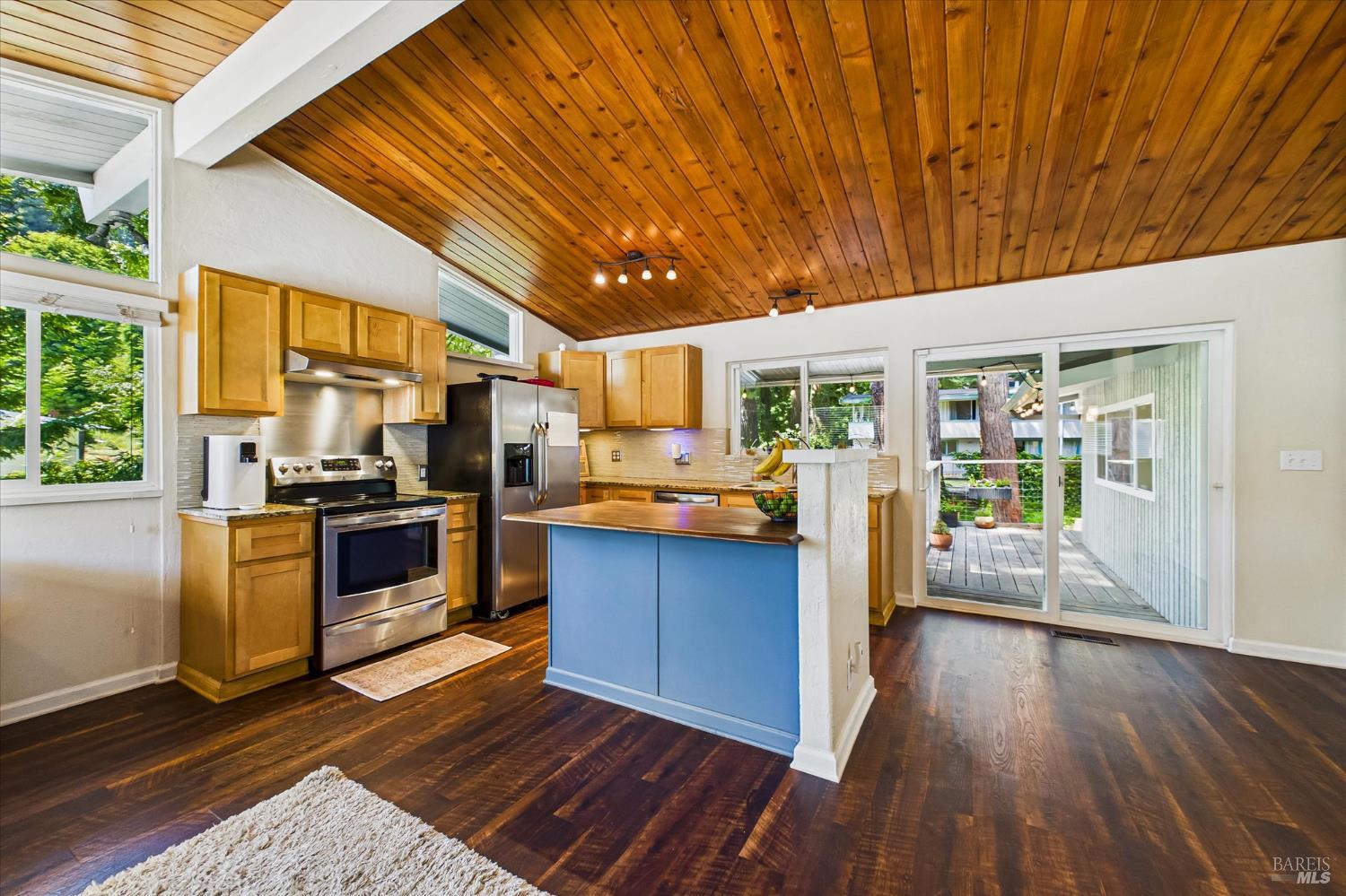 2305 Harris Street Eureka, CA 95503 - Photo 11 of 31 a kitchen with stainless steel appliances granite countertop a stove top oven a sink dishwasher a refrigerator and cabinets with wooden floor