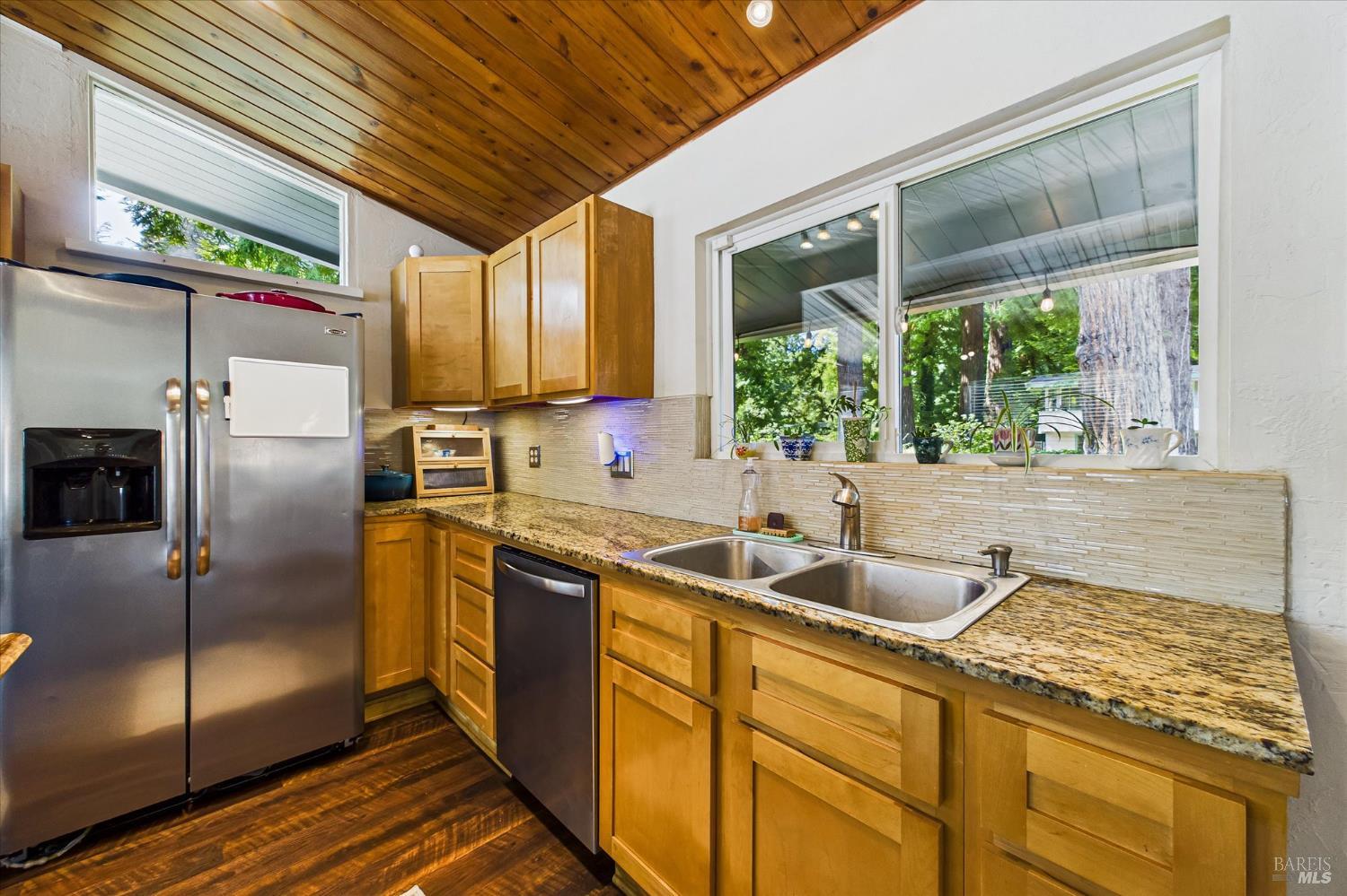 2305 Harris Street Eureka, CA 95503 - Photo 14 of 31 a kitchen with stainless steel appliances granite countertop a sink and a refrigerator