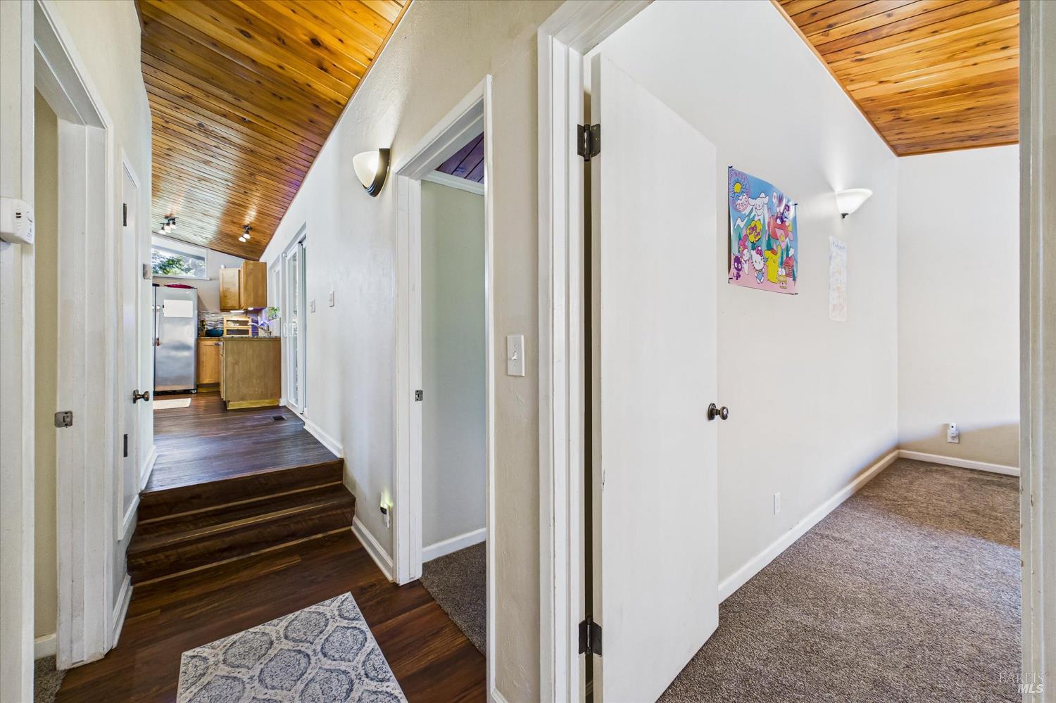 2305 Harris Street Eureka, CA 95503 - Photo 21 of 31 a view of a hallway with wooden floor and staircase