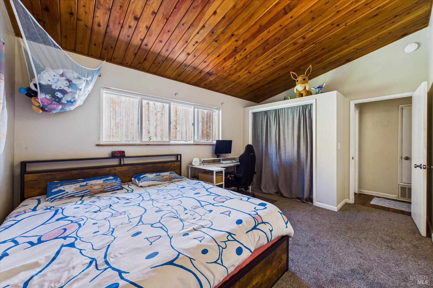 2305 Harris Street Eureka, CA 95503 - Photo 22 of 31 a bedroom with a bed and a chandelier
