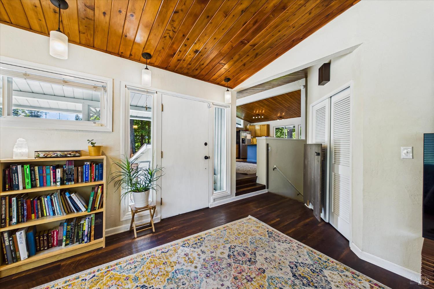 2305 Harris Street Eureka, CA 95503 - Photo 7 of 31 a view of a hallway with wooden floor and a bookshelf