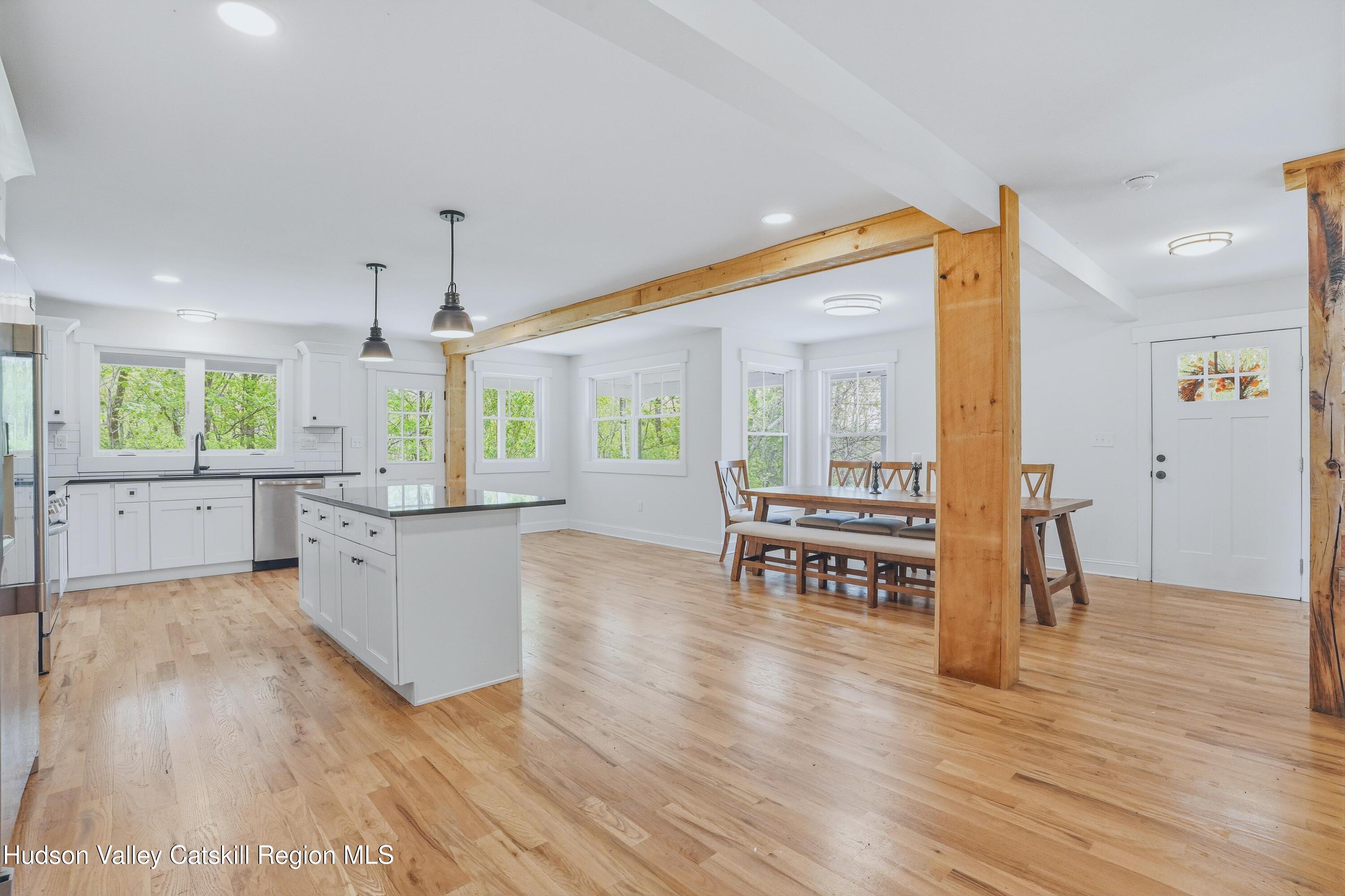 757 Taborton Road Sand Lake, NY 12153 - Photo 9 of 32 a open kitchen with white cabinets and wooden floor