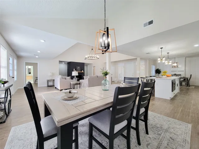 a view of a dining room and livingroom with furniture