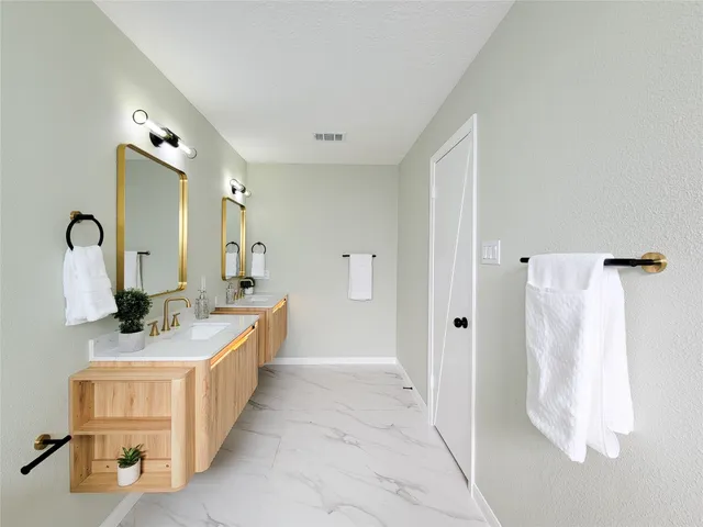 a bathroom with a sink and mirror