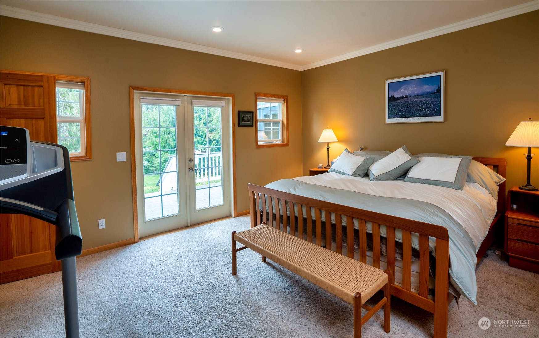 715 Palo Alto Road Sequim, WA 98382 - Photo 14 of 40 a bedroom with a bed and wooden floor