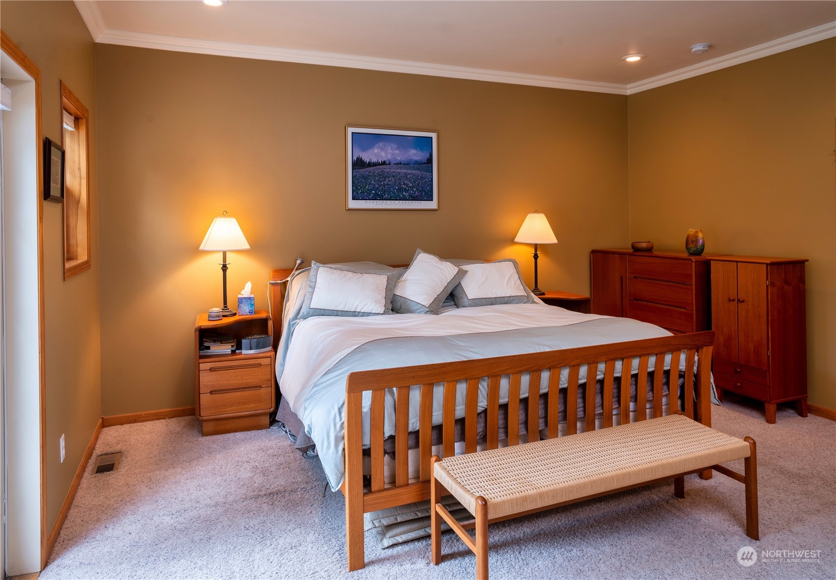 715 Palo Alto Road Sequim, WA 98382 - Photo 15 of 40 a bedroom with a bed a lamp and a couch