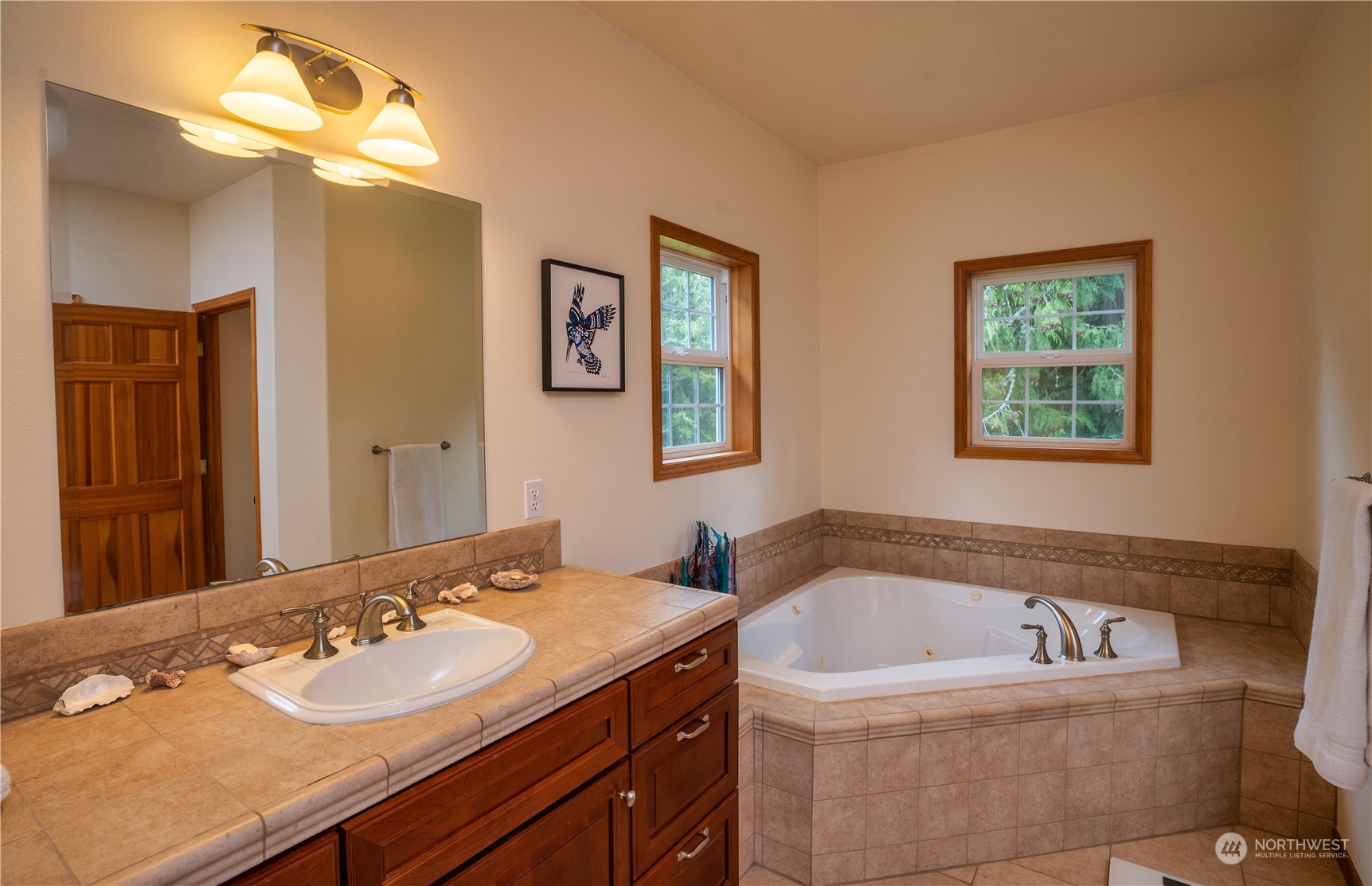715 Palo Alto Road Sequim, WA 98382 - Photo 16 of 40 a bathroom with a tub sink and mirror
