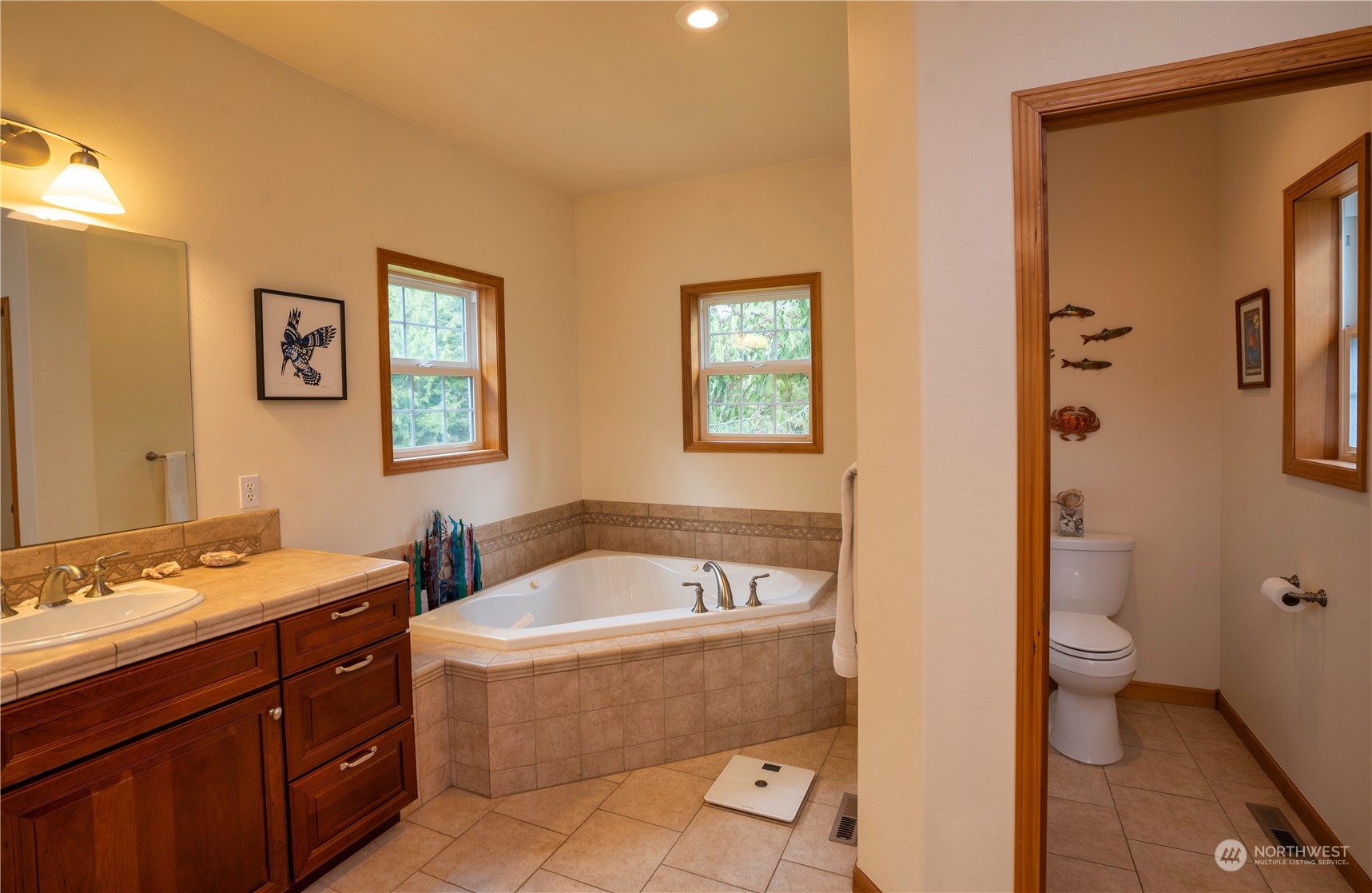 715 Palo Alto Road Sequim, WA 98382 - Photo 17 of 40 a bathroom with a tub a toilet a sink and a mirror