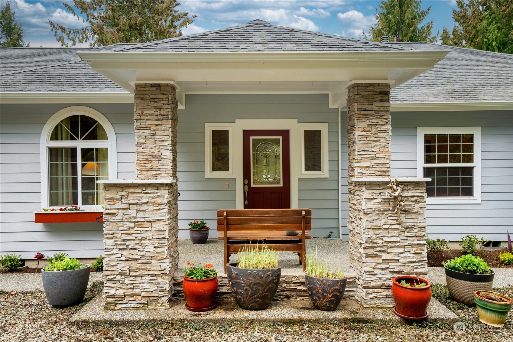 715 Palo Alto Road Sequim, WA 98382 - Photo 2 of 40 a front view of a house with outdoor seating