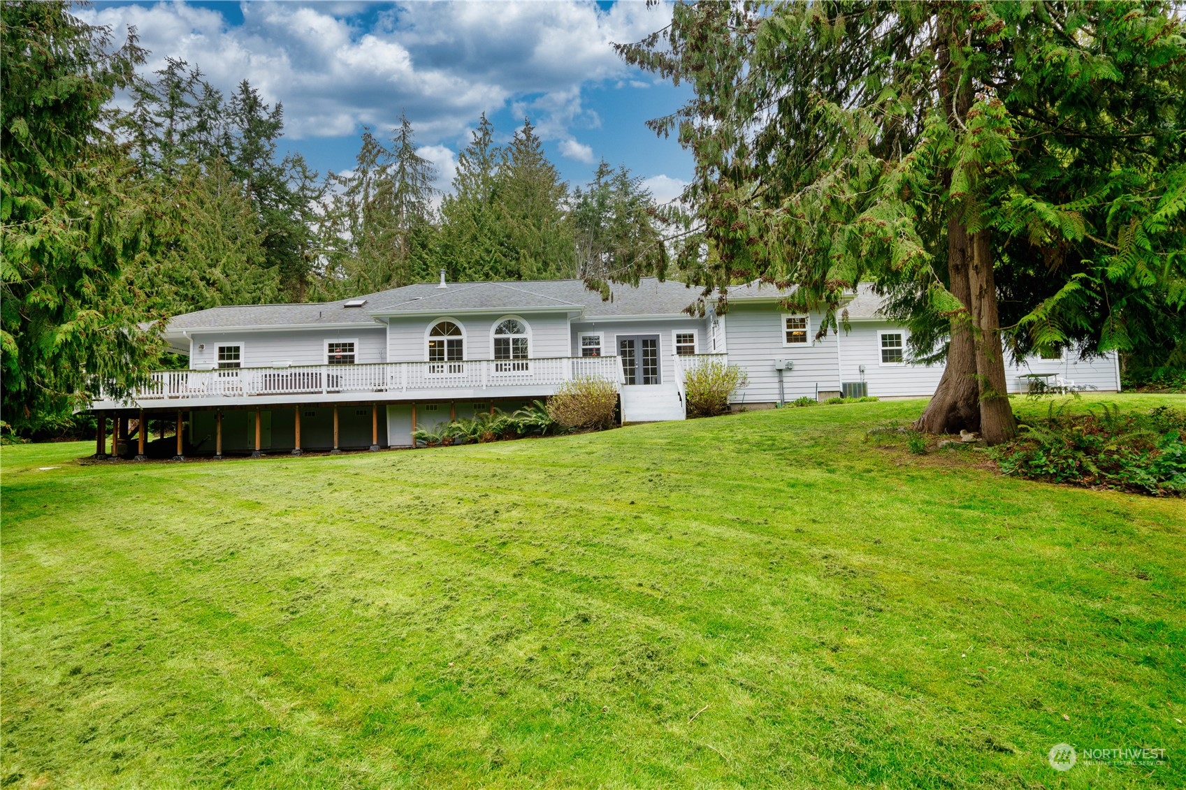715 Palo Alto Road Sequim, WA 98382 - Photo 33 of 40 a view of a house with a big yard potted plants and large tree