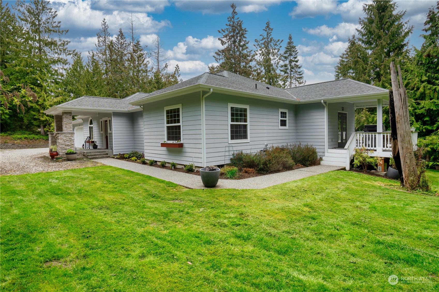 715 Palo Alto Road Sequim, WA 98382 - Photo 35 of 40 a front view of house with yard and outdoor seating