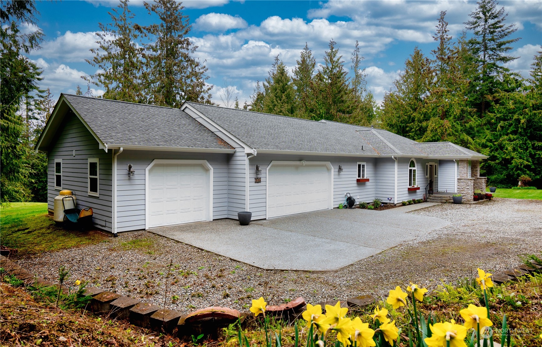 715 Palo Alto Road Sequim, WA 98382 - Photo 36 of 40 a front view of a house with a yard and garage