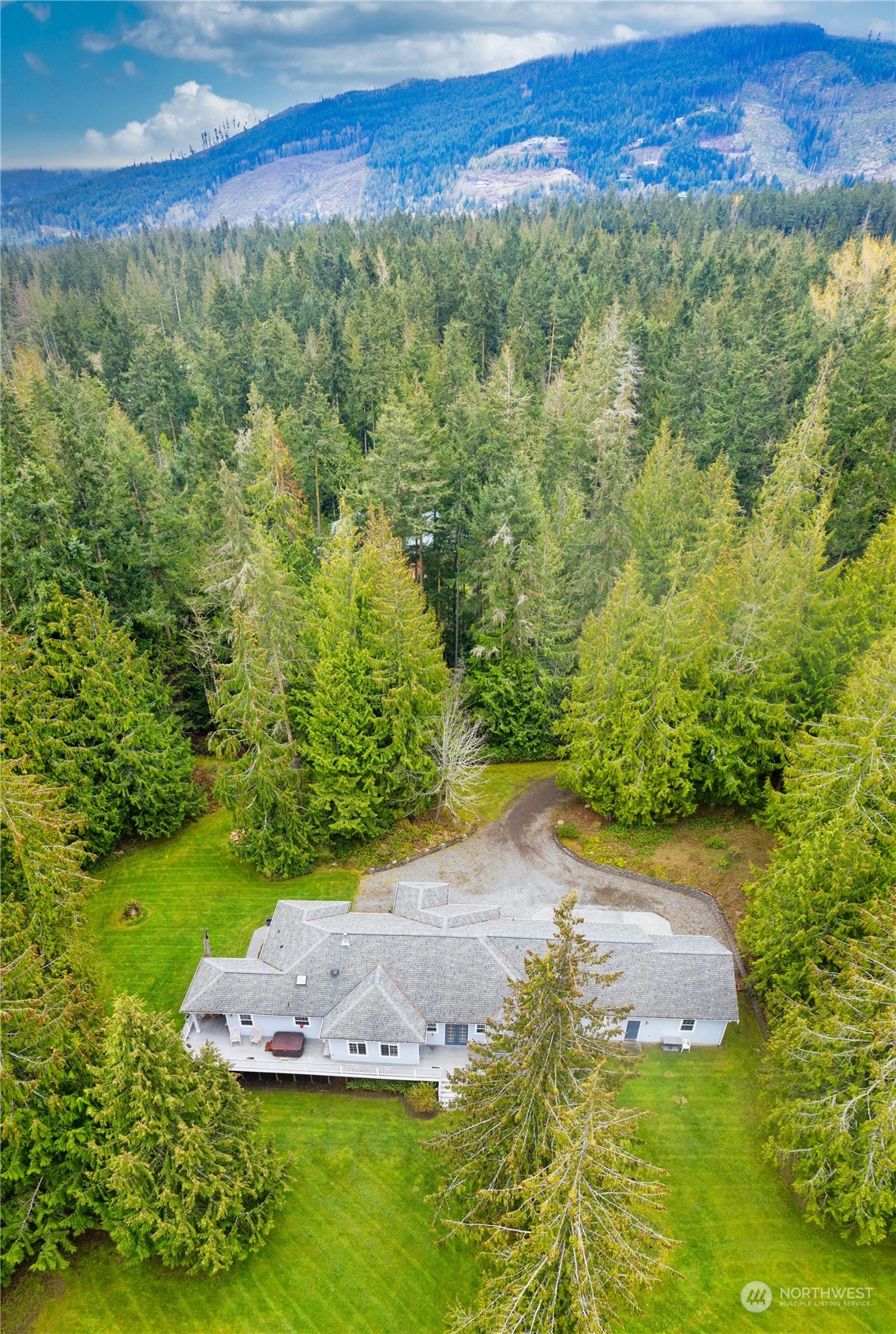 715 Palo Alto Road Sequim, WA 98382 - Photo 37 of 40 a view of a lush green outdoor space with a lake view