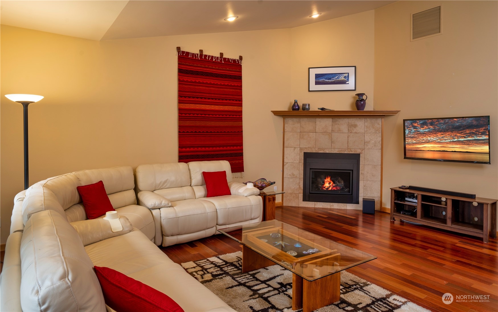 715 Palo Alto Road Sequim, WA 98382 - Photo 7 of 40 a living room with furniture a flat screen tv and a fireplace