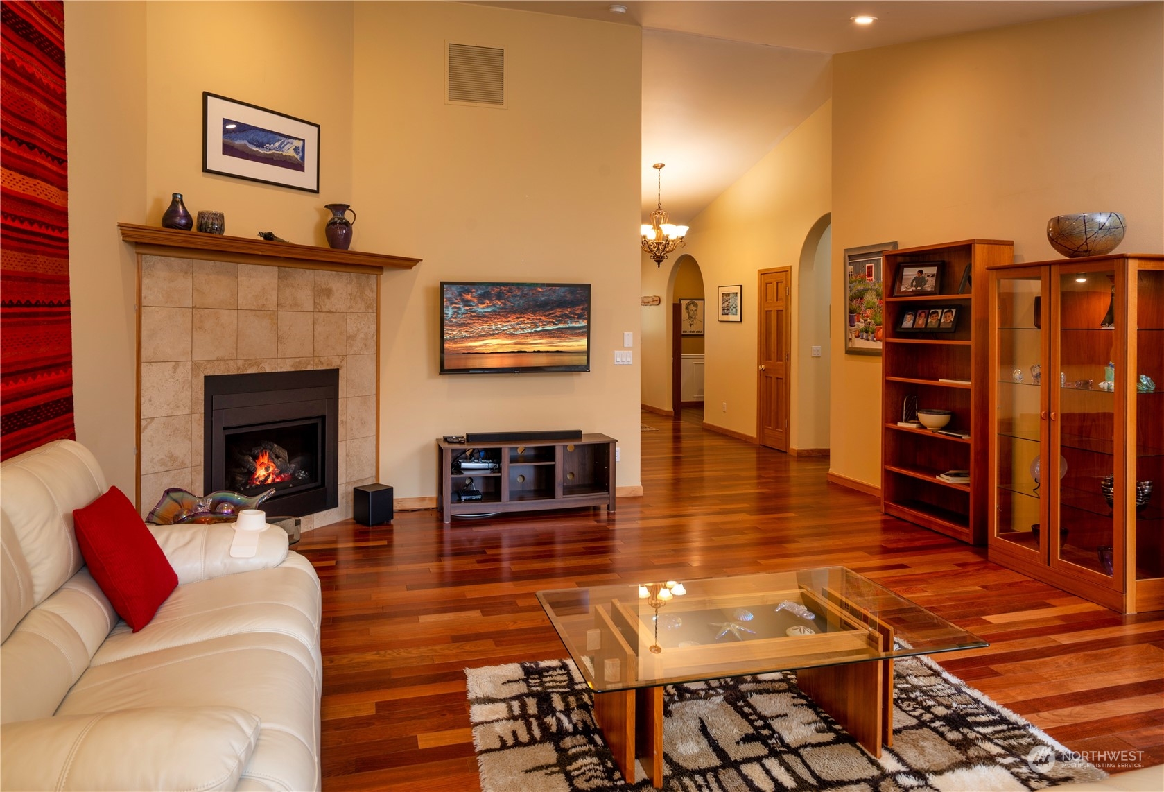715 Palo Alto Road Sequim, WA 98382 - Photo 8 of 40 a living room with furniture a flat screen tv and a fireplace