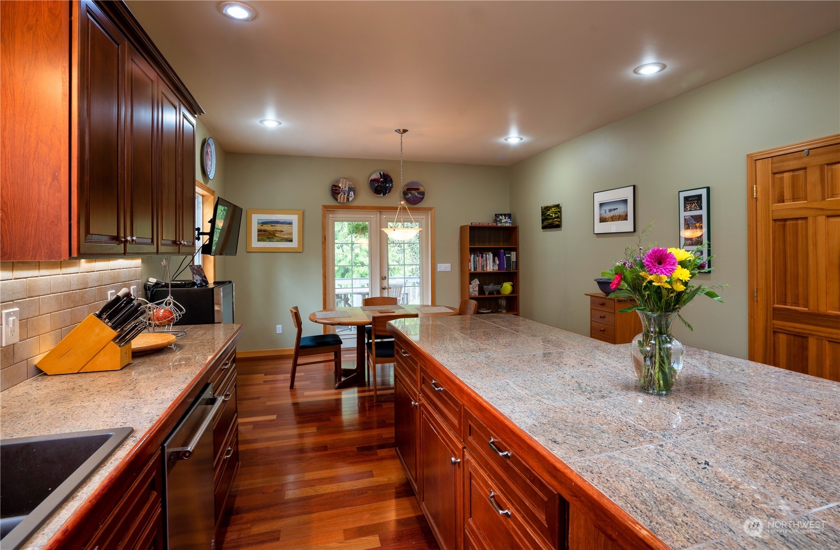 715 Palo Alto Road Sequim, WA 98382 - Photo 10 of 40 a kitchen with stainless steel appliances granite countertop sink stove and refrigerator
