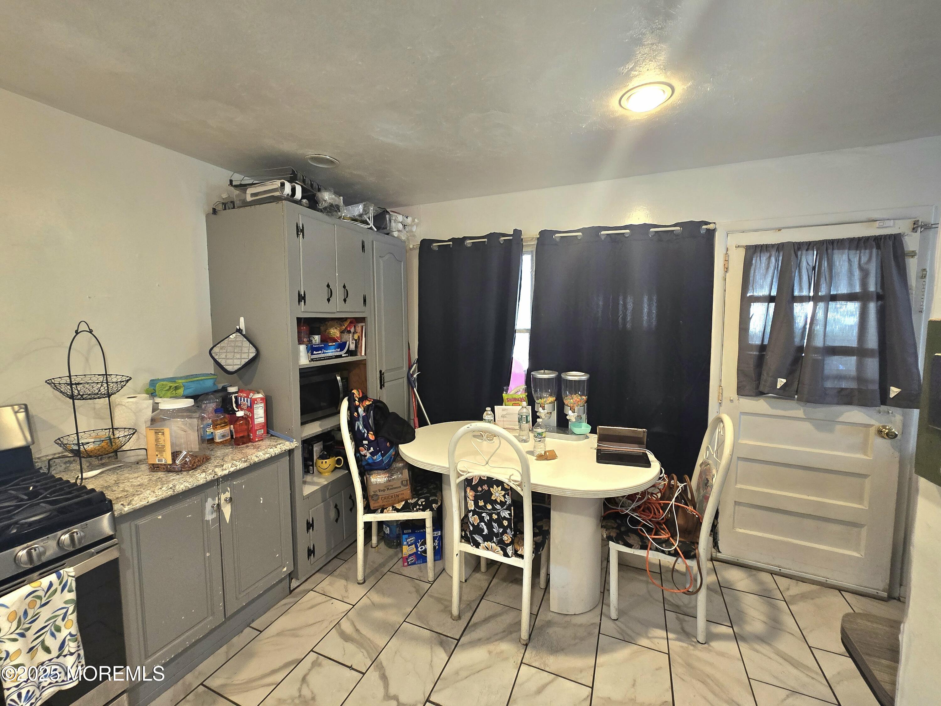 11 Trident Boulevard Neptune Township, NJ 07753 - Photo 11 of 25 a view of a dining room with furniture