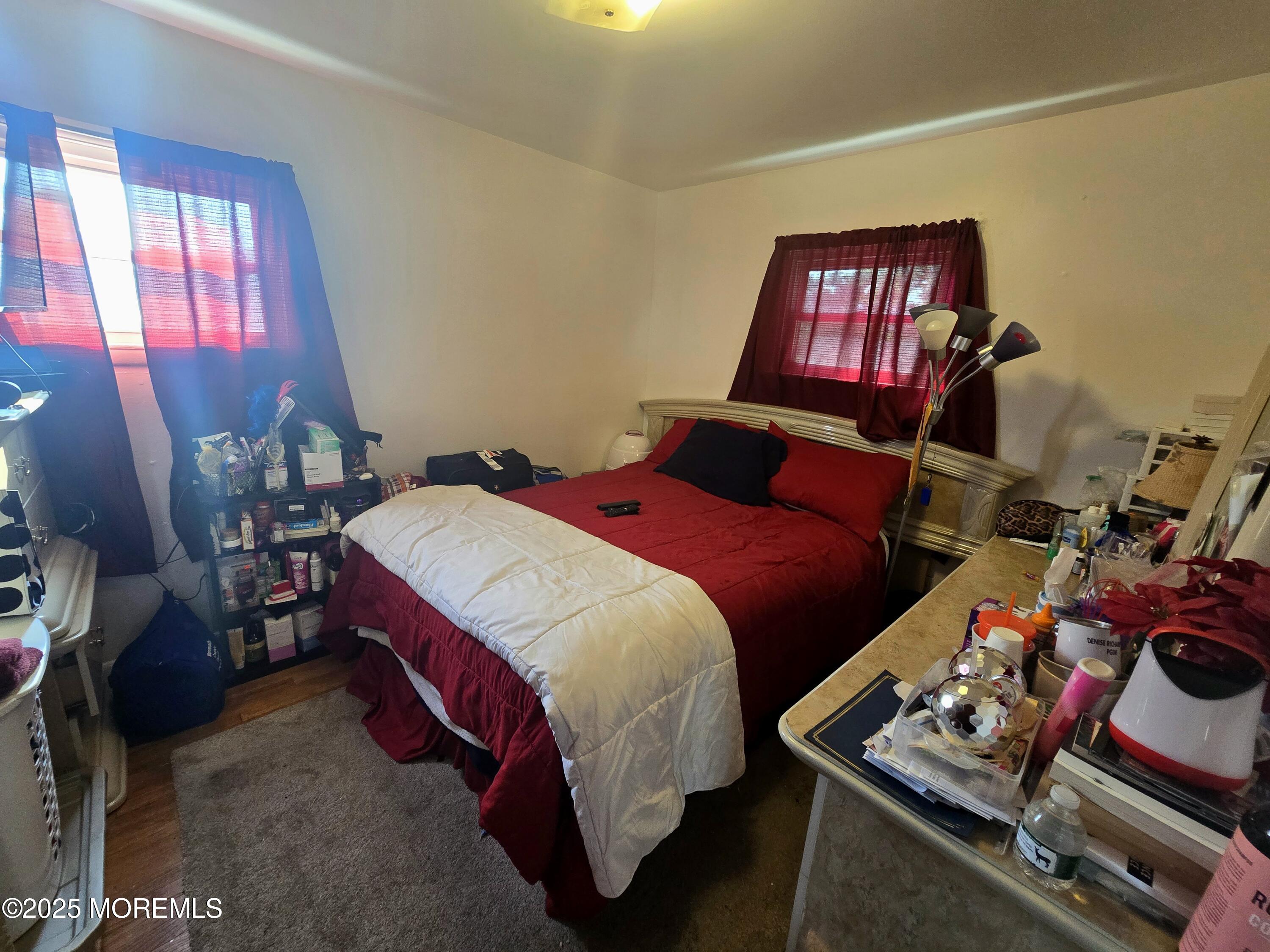 11 Trident Boulevard Neptune Township, NJ 07753 - Photo 13 of 25 a bedroom with a bed and dresser