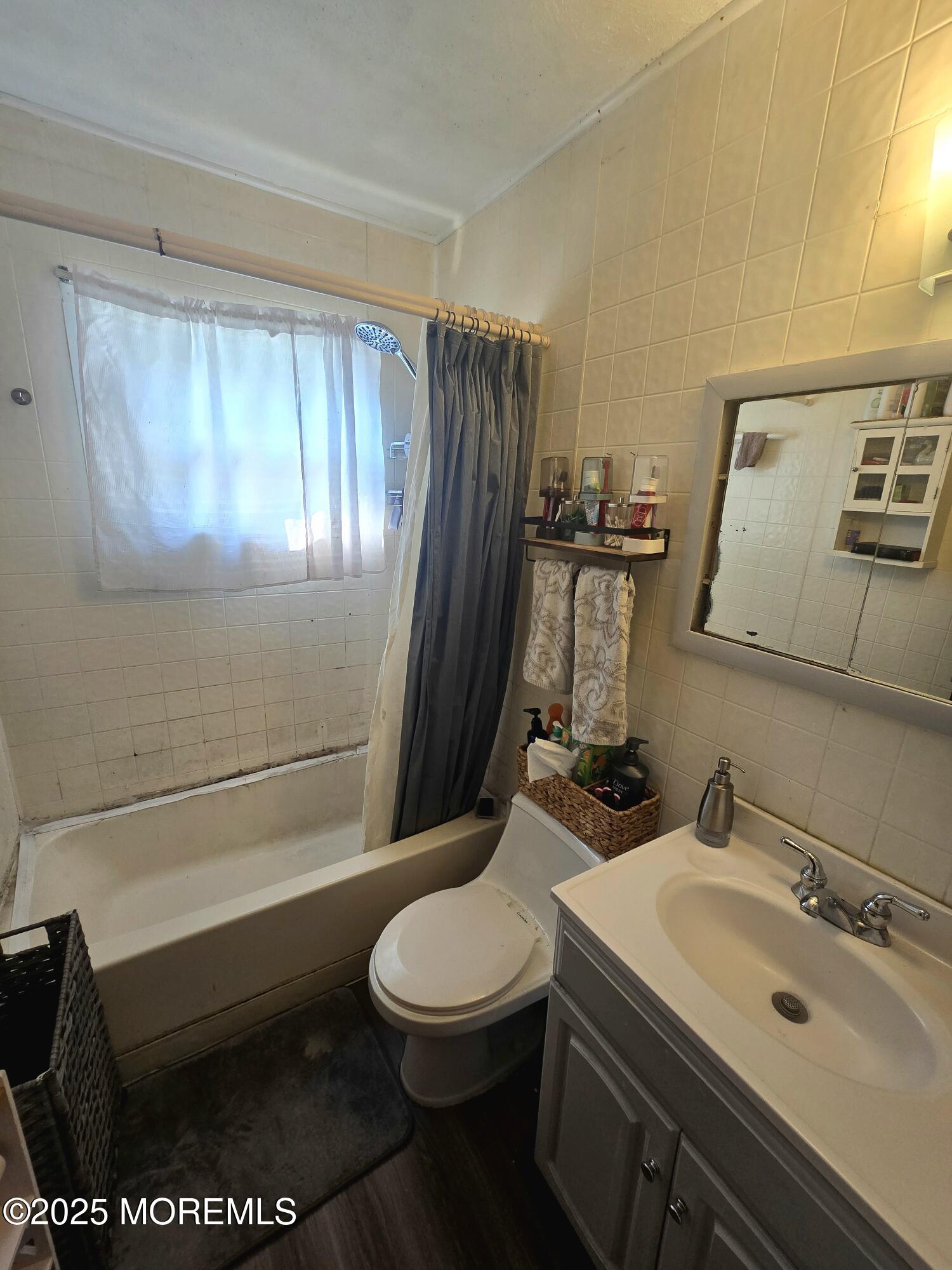 11 Trident Boulevard Neptune Township, NJ 07753 - Photo 15 of 25 a bathroom with a sink toilet and shower