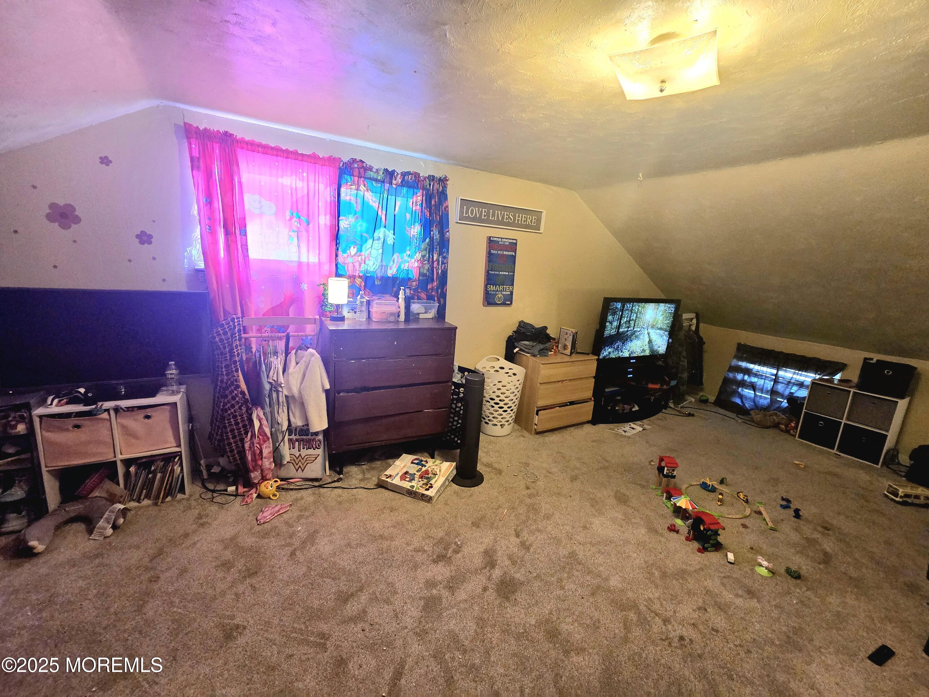 11 Trident Boulevard Neptune Township, NJ 07753 - Photo 18 of 25 a bed room with a bed and a chair