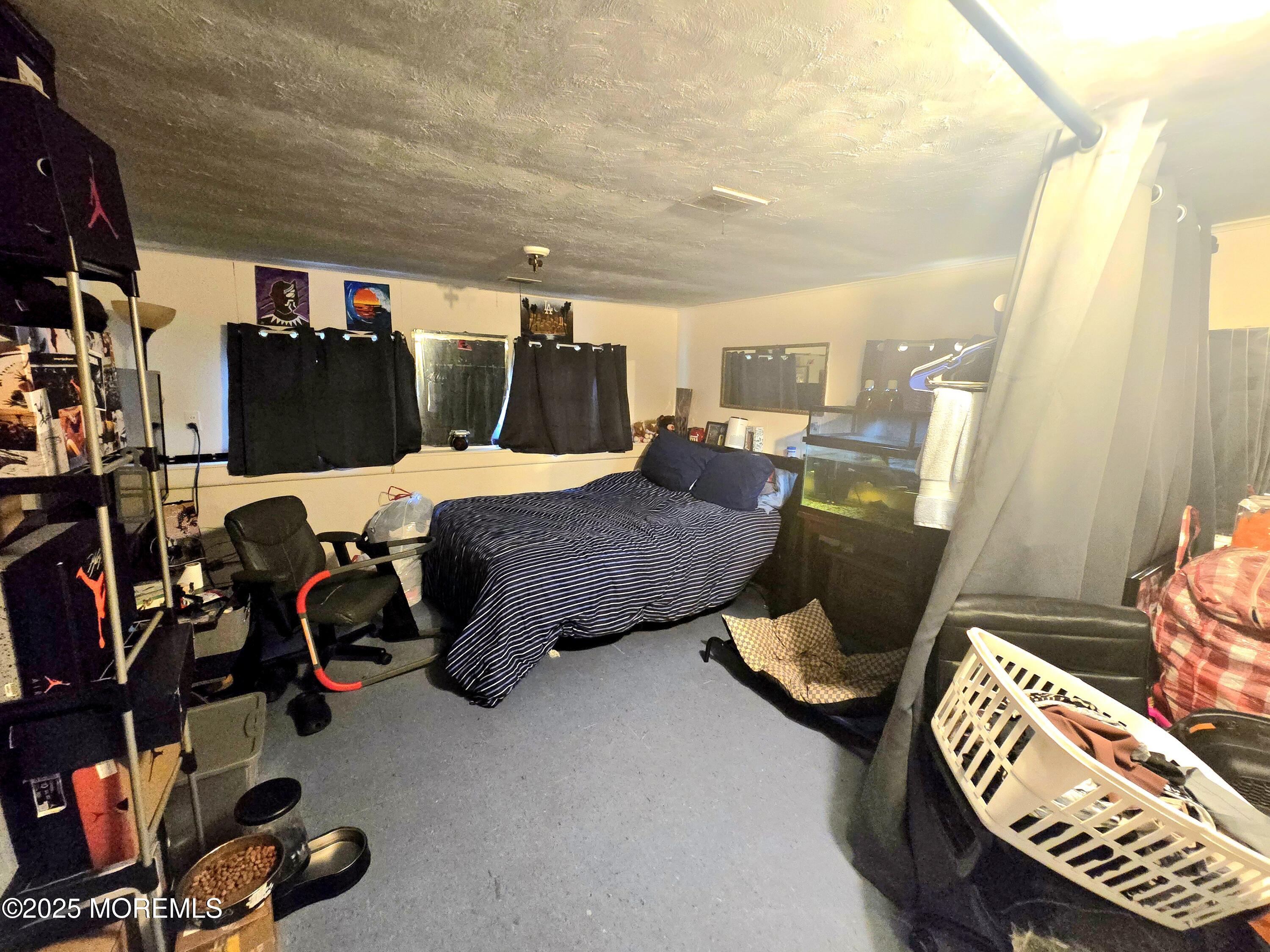 11 Trident Boulevard Neptune Township, NJ 07753 - Photo 19 of 25 a bed room with furniture and gym equipment