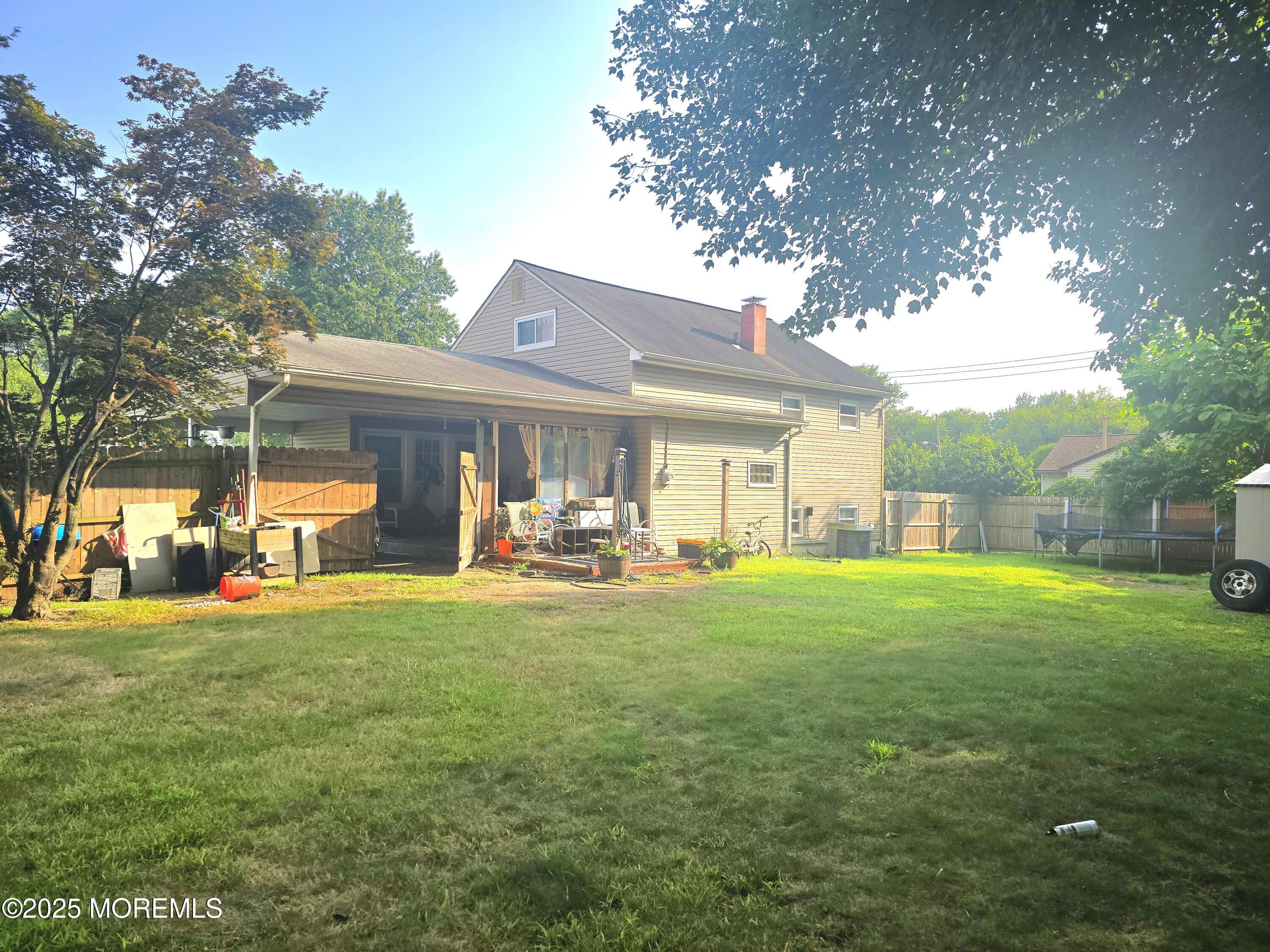 11 Trident Boulevard Neptune Township, NJ 07753 - Photo 3 of 25 a view of a house with a yard porch and sitting area