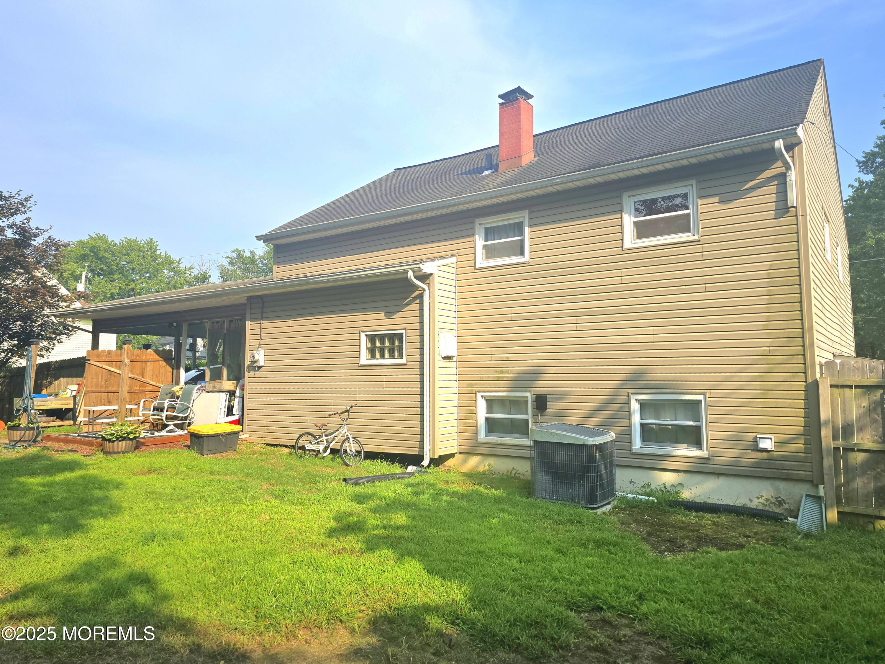 11 Trident Boulevard Neptune Township, NJ 07753 - Photo 4 of 25 front view of a house with a yard