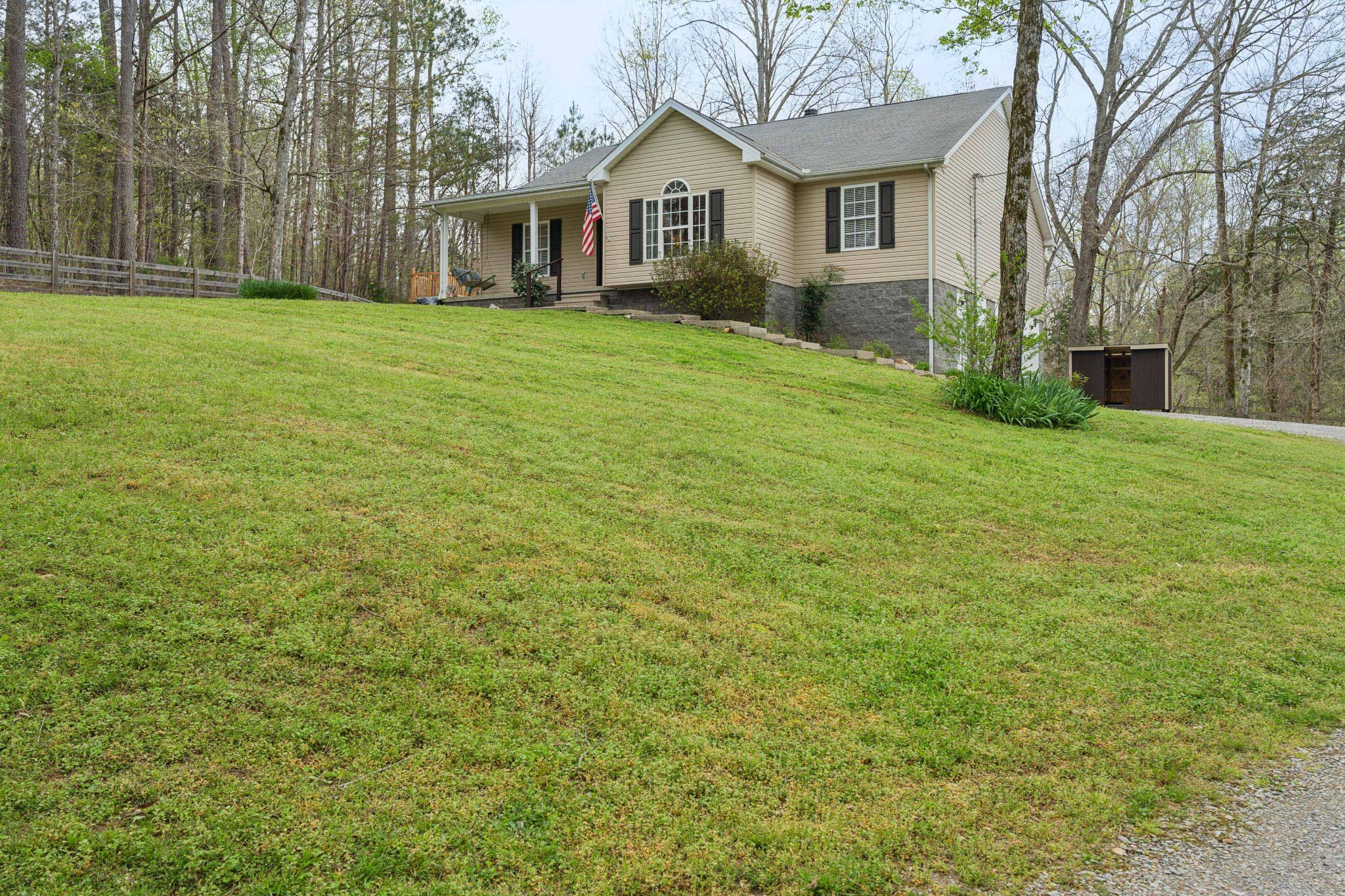 7375 Sac Lampley Road Bon Aqua, TN 37025 - Photo 2 of 29 a front view of a house with a yard