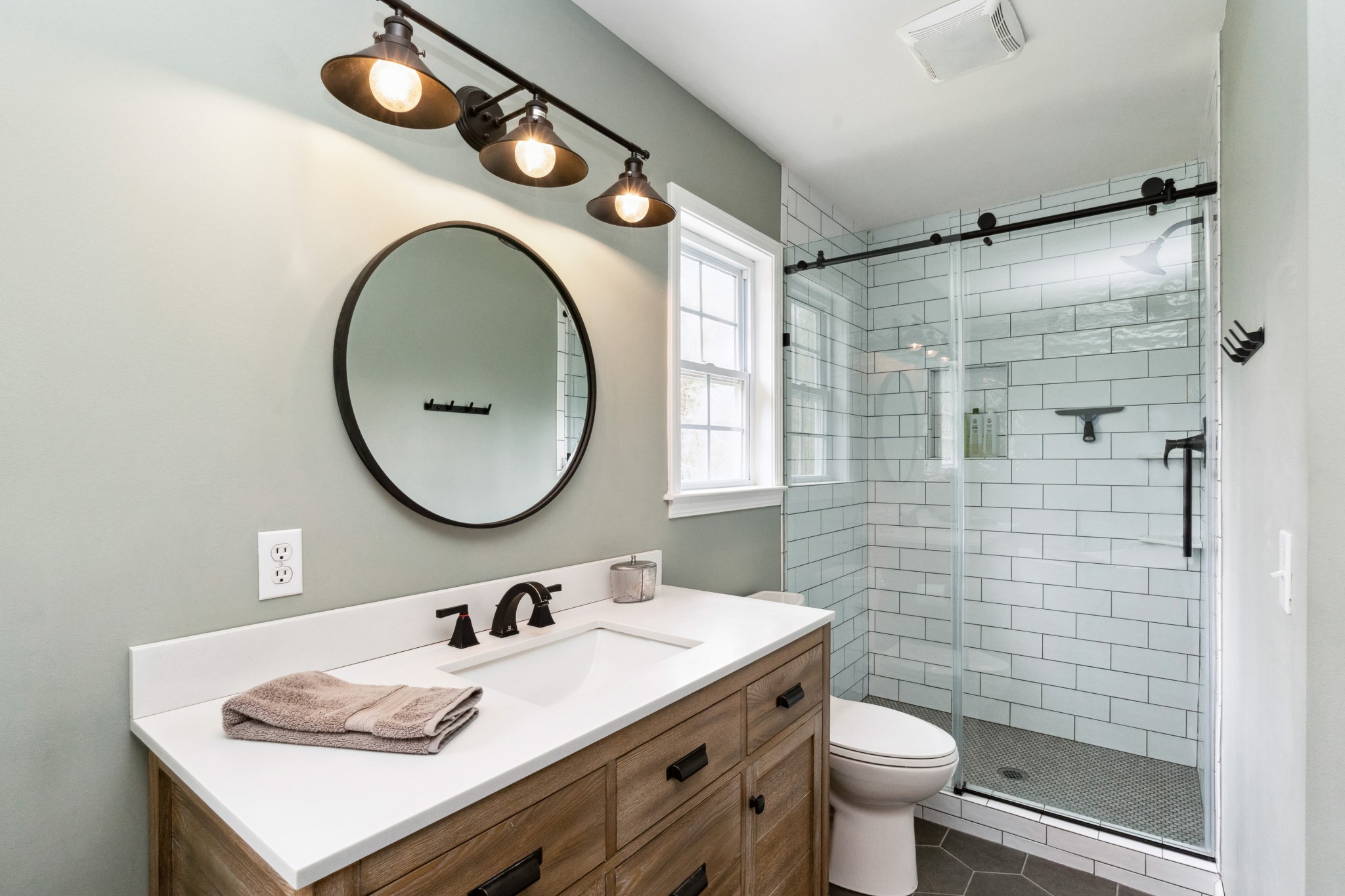 7375 Sac Lampley Road Bon Aqua, TN 37025 - Photo 21 of 29 a bathroom with a sink a toilet and a mirror