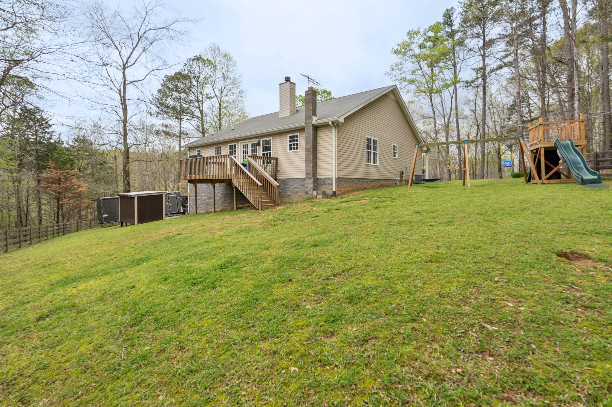 7375 Sac Lampley Road Bon Aqua, TN 37025 - Photo 23 of 29 a view of a house with backyard and garden