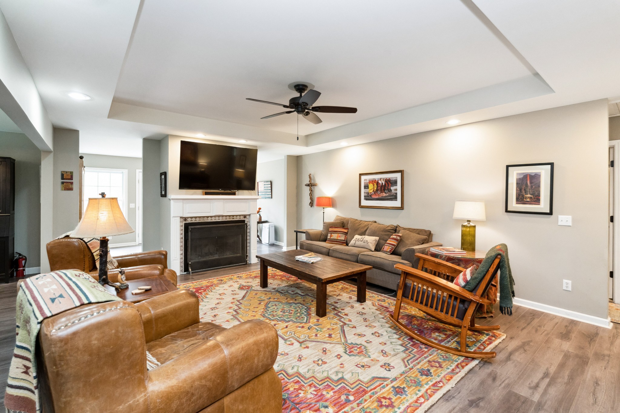7375 Sac Lampley Road Bon Aqua, TN 37025 - Photo 5 of 29 a living room with furniture a fireplace and a flat screen tv