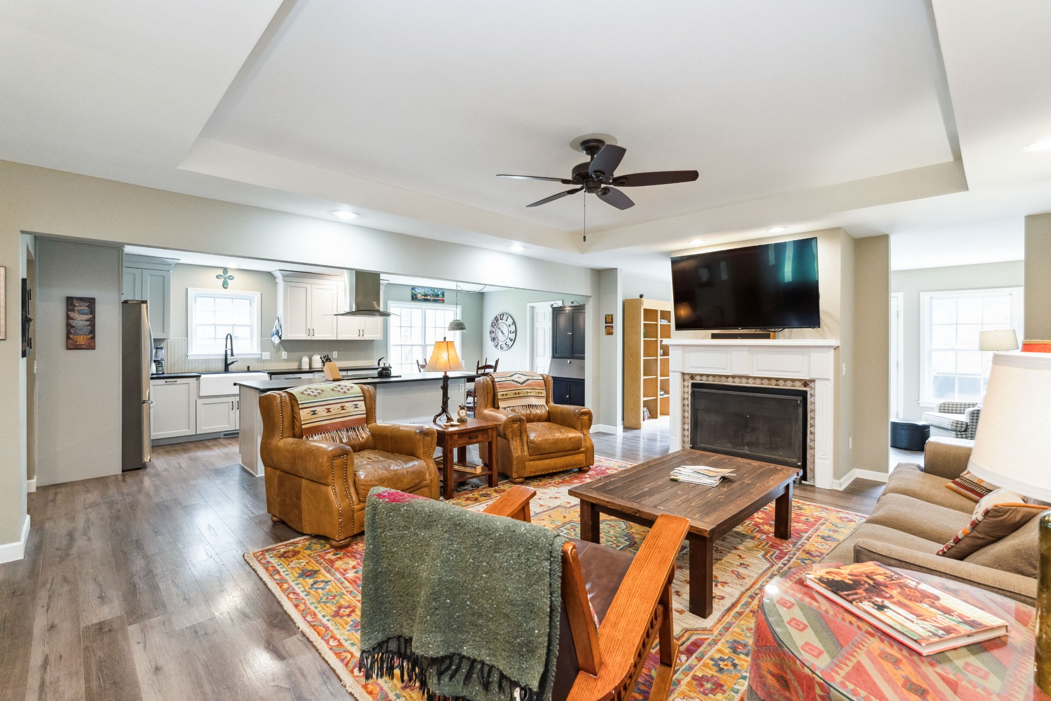 7375 Sac Lampley Road Bon Aqua, TN 37025 - Photo 7 of 29 a living room with fireplace a fireplace and a flat screen tv