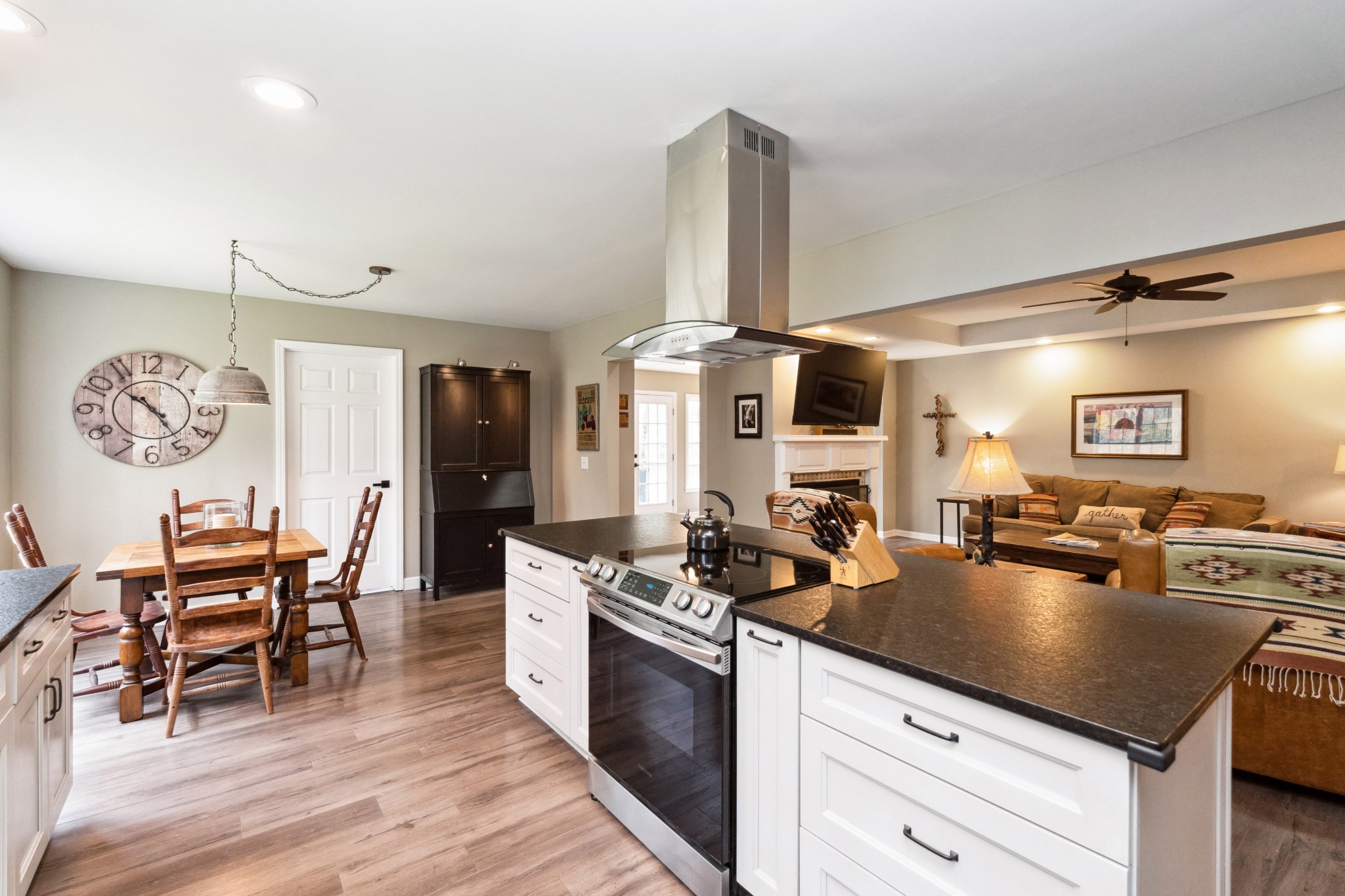 7375 Sac Lampley Road Bon Aqua, TN 37025 - Photo 9 of 29 a kitchen with a table chairs stove and cabinets