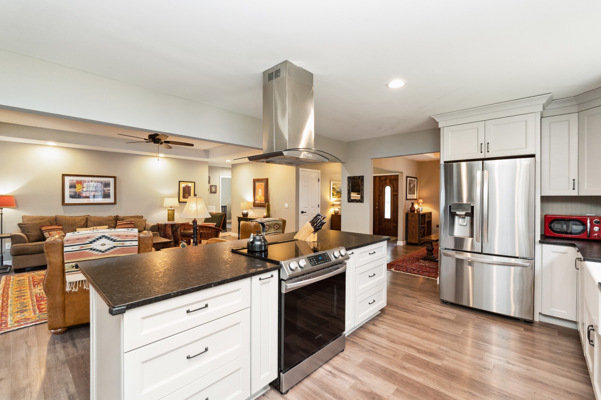 7375 Sac Lampley Road Bon Aqua, TN 37025 - Photo 10 of 29 a kitchen with counter top space cabinets and stainless steel appliances