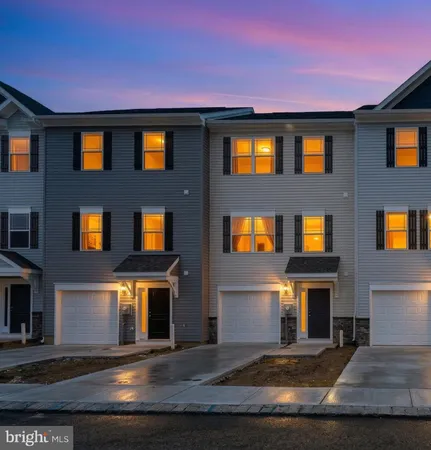 a front view of a house with yard