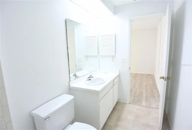 a bathroom with a sink toilet and tub